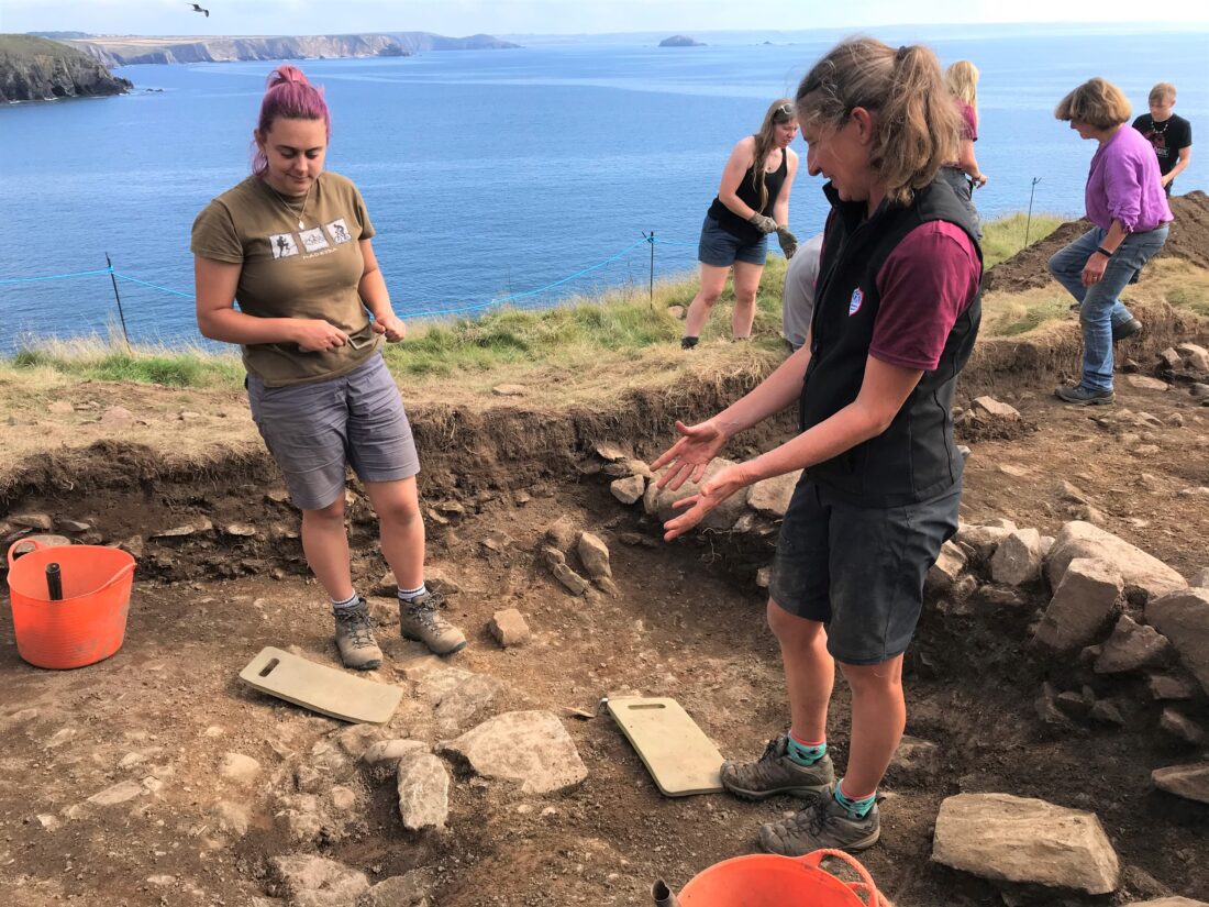 Venturers discuss features in trench 1