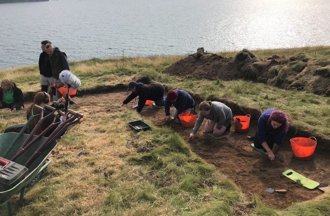 Excavating down the next layer in trench 1