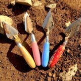 An image of four trowels